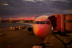airplane at the gate at sunrise
